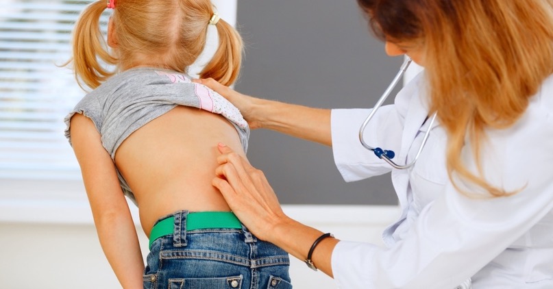Doctor Diagnosing a Little Girls Back